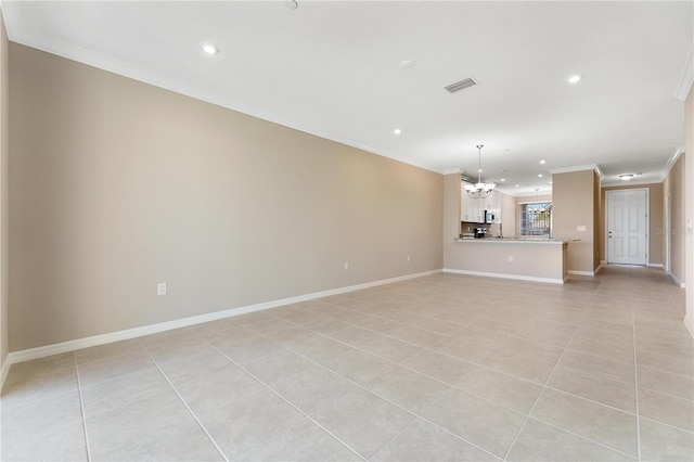 unfurnished living room featuring light tile patterned floors, a notable chandelier, and ornamental molding