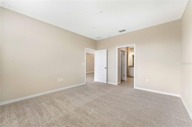 unfurnished bedroom with light carpet