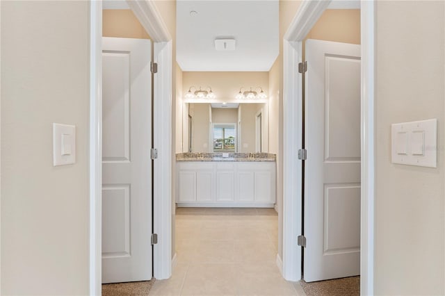 hallway featuring light tile patterned floors