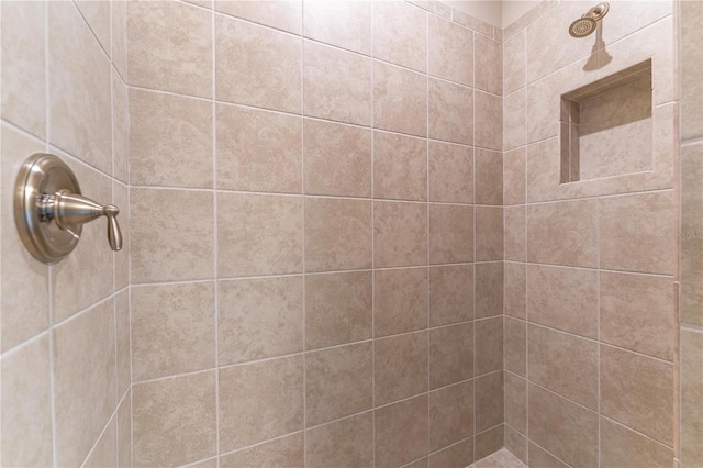 bathroom with tiled shower