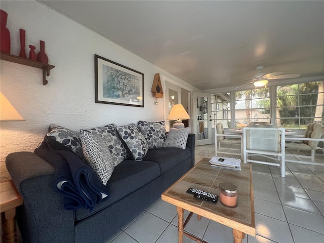 tiled living room with ceiling fan