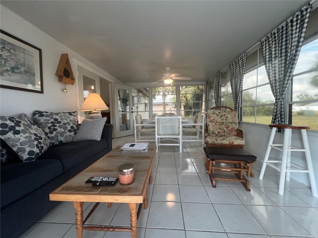 living room with tile patterned flooring and ceiling fan