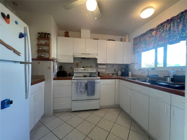 kitchen featuring white appliances, sink, ceiling fan, tasteful backsplash, and white cabinetry