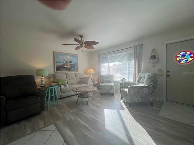 living room with hardwood / wood-style flooring and ceiling fan