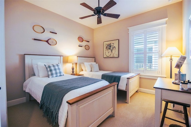 bedroom featuring ceiling fan and light colored carpet