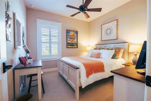 bedroom with ceiling fan and carpet floors