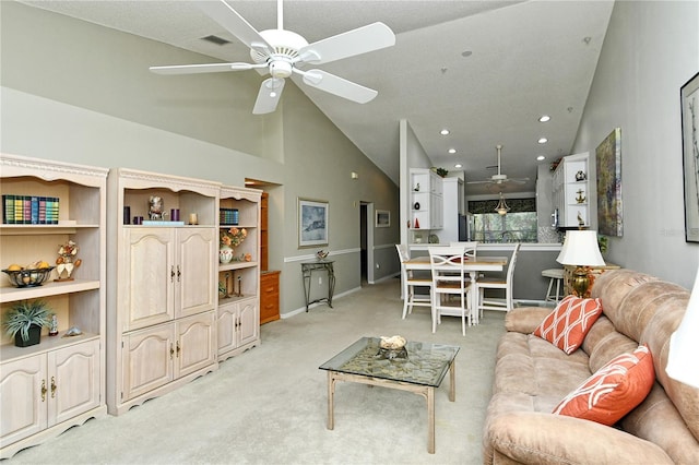 carpeted living room featuring high vaulted ceiling and ceiling fan