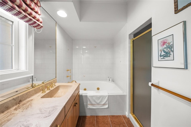 bathroom with independent shower and bath, vanity, and tile patterned floors