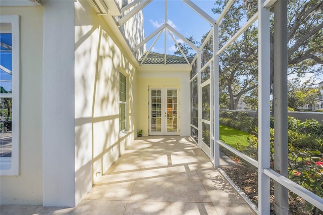 unfurnished sunroom featuring french doors