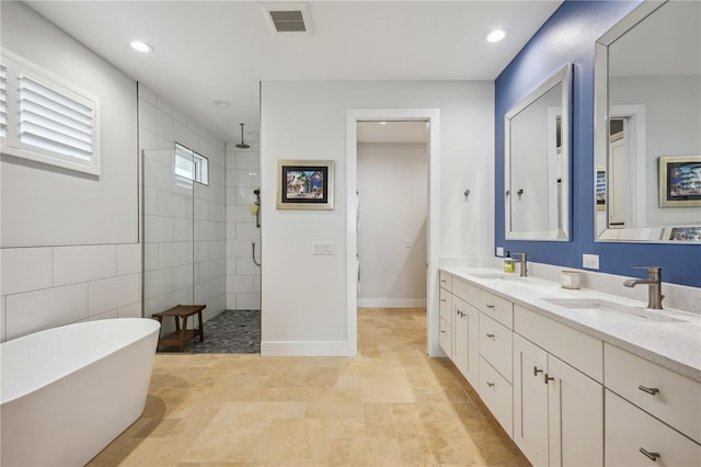 bathroom with plus walk in shower and vanity