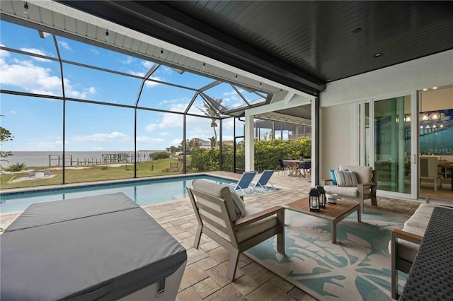 view of swimming pool with a lanai, a patio, a water view, and an outdoor hangout area