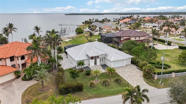 birds eye view of property featuring a water view