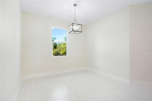 empty room with a notable chandelier