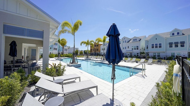 view of swimming pool featuring a patio