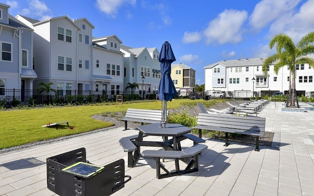 view of home's community with a patio area and a yard