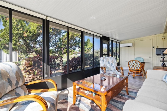 sunroom featuring a wall mounted AC and a wealth of natural light