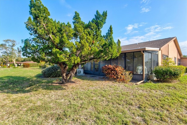 view of yard featuring a sunroom