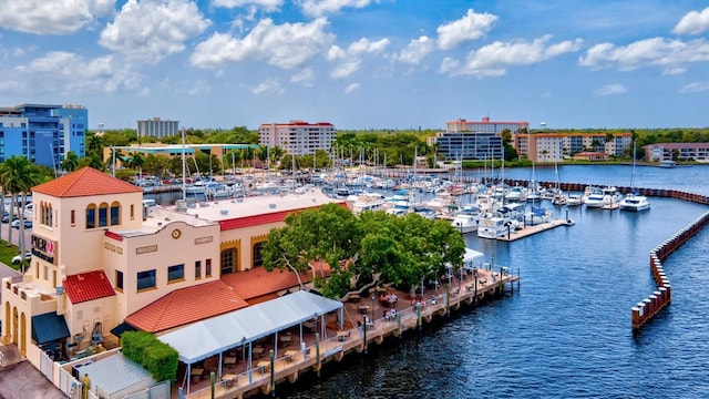 birds eye view of property with a water view