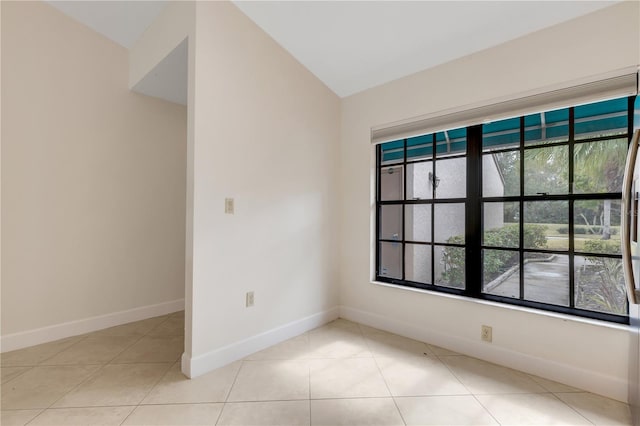 spare room with light tile patterned floors