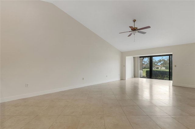 tiled empty room featuring high vaulted ceiling and ceiling fan