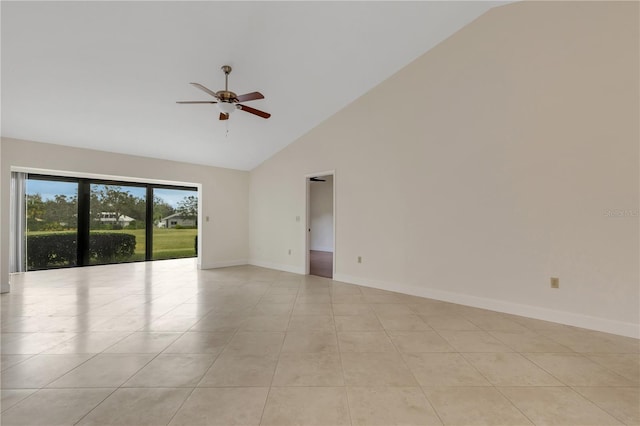 tiled empty room with high vaulted ceiling and ceiling fan