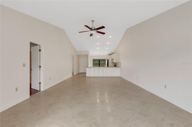 unfurnished living room featuring high vaulted ceiling, light tile patterned floors, and ceiling fan