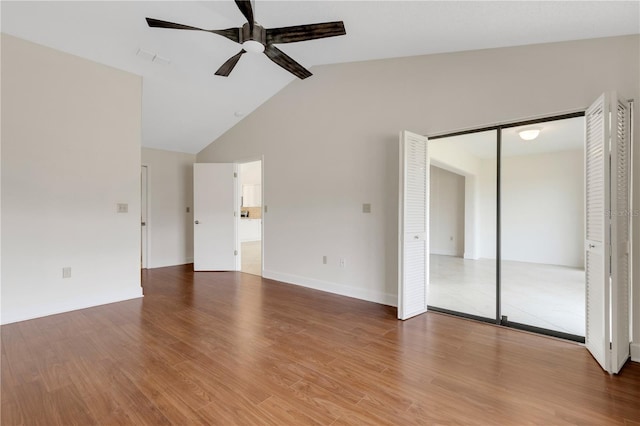 interior space with hardwood / wood-style flooring, lofted ceiling, and ceiling fan
