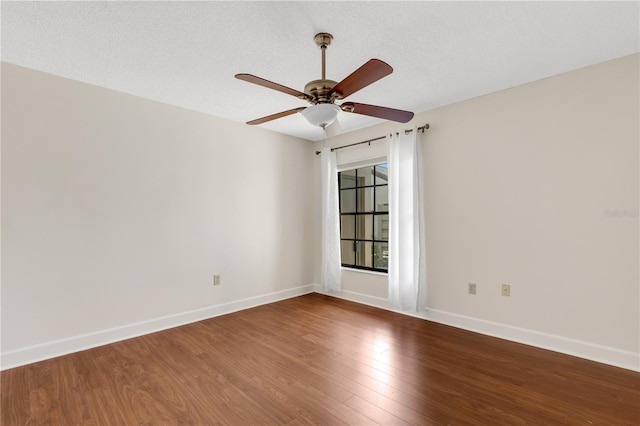 unfurnished room with hardwood / wood-style flooring, ceiling fan, and a textured ceiling