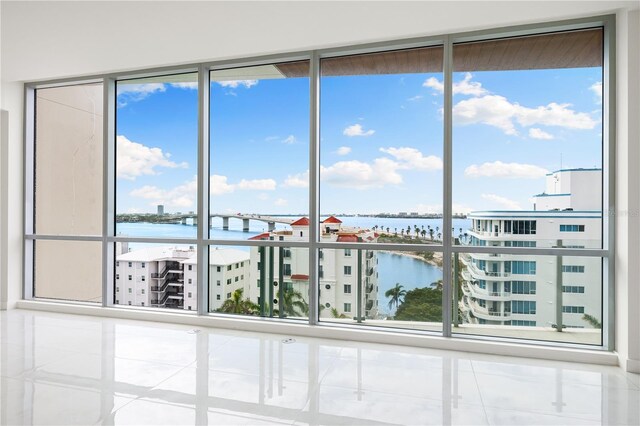 111 Golden Gate Pt Unit 701Ph, Sarasota, FL 34236 - unfurnished sunroom with a water view