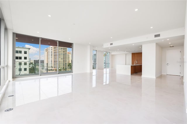 111 Golden Gate Pt Unit 701Ph, Sarasota, FL 34236 - empty room featuring floor to ceiling windows, recessed lighting, a sink, and visible vents