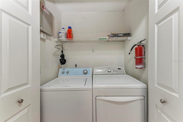 laundry area with washer and clothes dryer