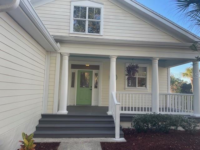 doorway to property with covered porch