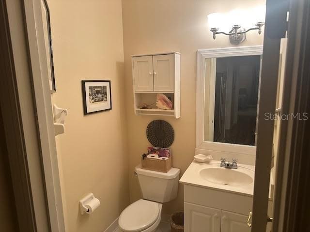 bathroom with vanity and toilet