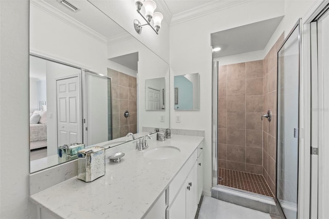 bathroom with ornamental molding, walk in shower, tile patterned flooring, and vanity