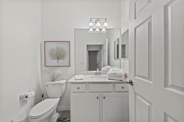 bathroom with toilet and vanity