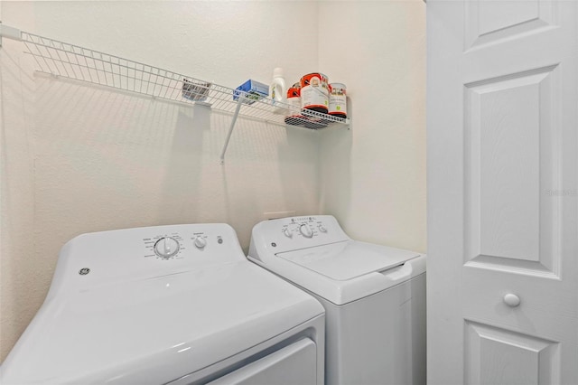 washroom with washer and dryer