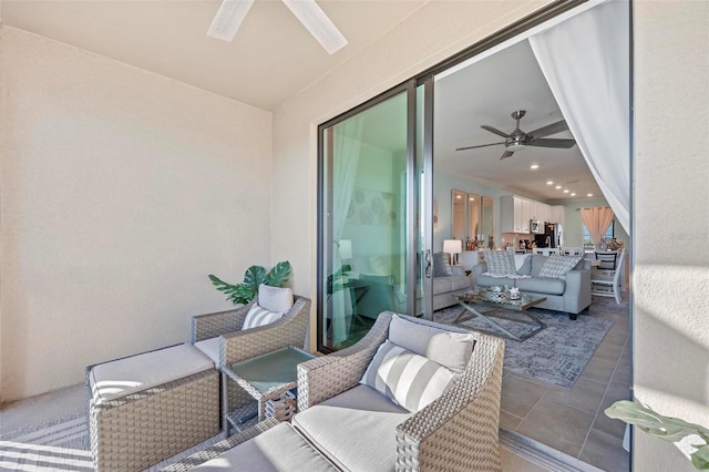 interior space with ceiling fan and outdoor lounge area