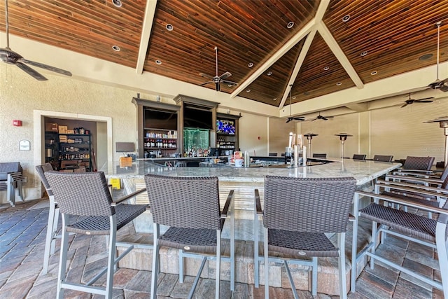 interior space featuring ceiling fan, an outdoor bar, and a gazebo