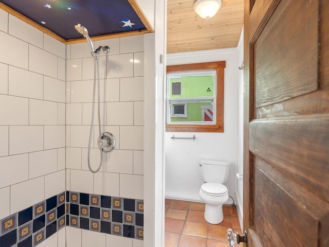 bathroom featuring tiled shower, crown molding, wooden ceiling, and toilet