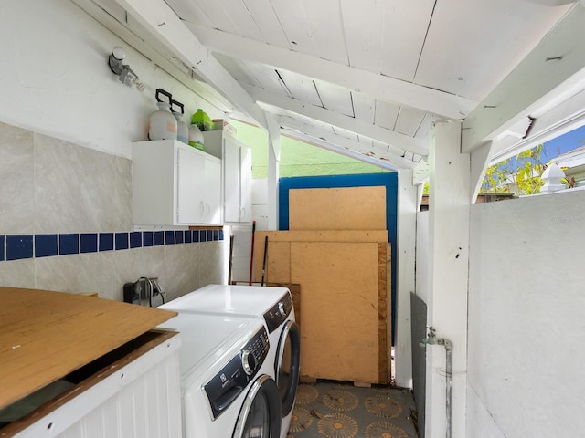 laundry room with cabinets, washer and clothes dryer, and wooden ceiling