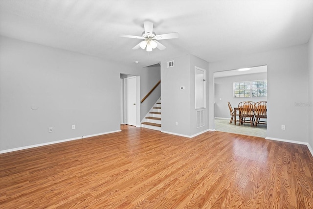 spare room featuring ceiling fan and light hardwood / wood-style floors