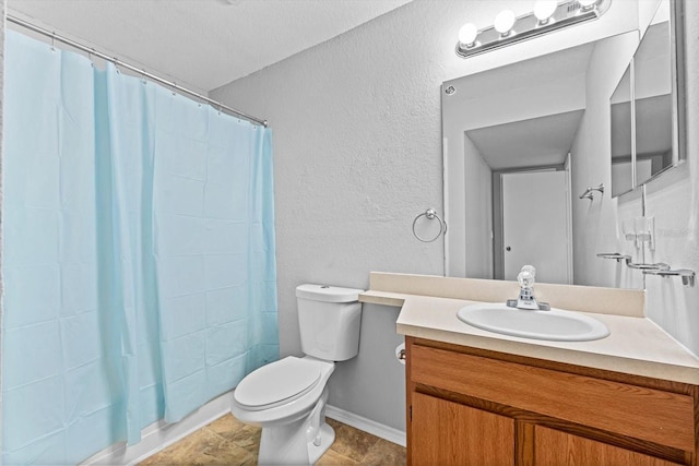 bathroom featuring walk in shower, vanity, and toilet