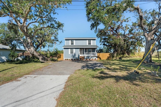 view of front of property featuring a porch and a front yard