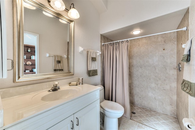 bathroom featuring toilet, tile patterned flooring, a shower with curtain, and vanity