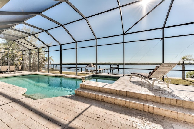 view of swimming pool featuring a water view, a patio, glass enclosure, and an in ground hot tub