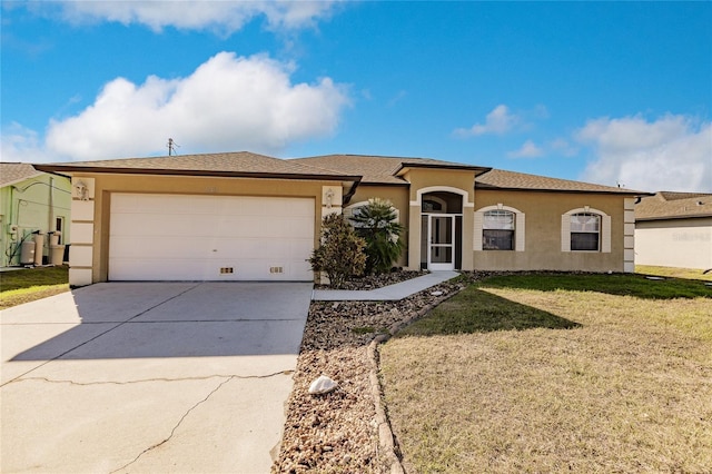 single story home with a front yard and a garage