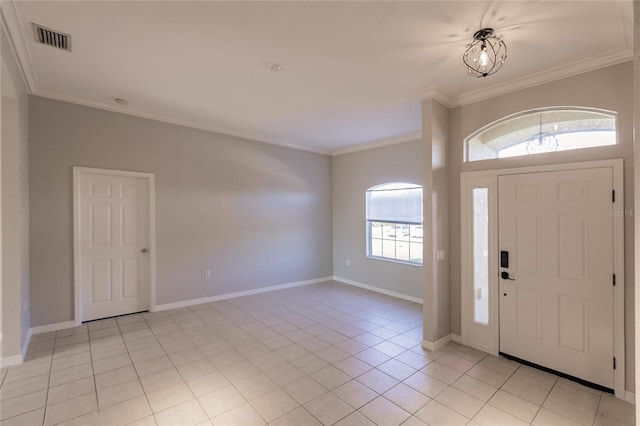 entrance foyer featuring light tile patterned floors and crown molding