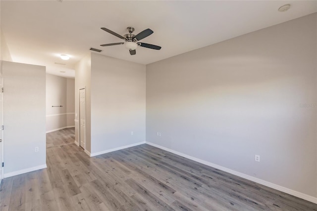 unfurnished room featuring ceiling fan and light hardwood / wood-style floors