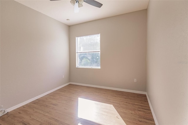 spare room with light hardwood / wood-style flooring and ceiling fan