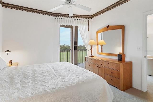 bedroom featuring ornamental molding, ceiling fan, light colored carpet, and access to outside